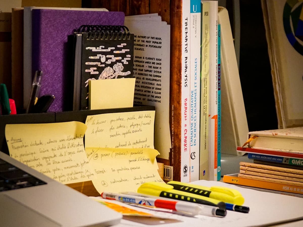 Illustrative photograph of books and study materials on a desk